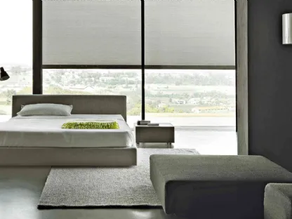 Letto dal design lineare in tessuto completamente sfoderabile con testiera Softland di Lema